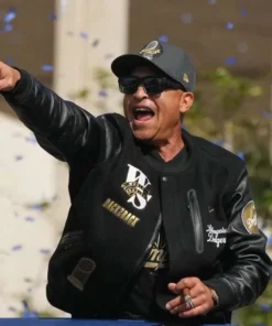 Product Specification: Inspired By: Dave Roberts External Material: Wool Fabric with leather Sleeves Inner Lining: Viscose Lining Front: Zipper and Buttoned Closure Collar: Ribbed Collar Color: Black Pockets: Three at Front and Two Inside Sleeves: Full-length Sleeves with Ribbed Cuffs