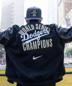 Product Specification: Inspired By: Dave Roberts External Material: Wool Fabric with leather Sleeves Inner Lining: Viscose Lining Front: Zipper and Buttoned Closure Collar: Ribbed Collar Color: Black Pockets: Three at Front and Two Inside Sleeves: Full-length Sleeves with Ribbed Cuffs