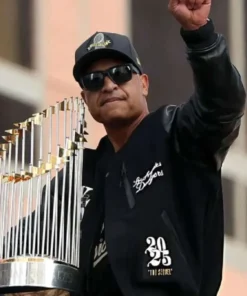 Product Specification: Inspired By: Dave Roberts External Material: Wool Fabric with leather Sleeves Inner Lining: Viscose Lining Front: Zipper and Buttoned Closure Collar: Ribbed Collar Color: Black Pockets: Three at Front and Two Inside Sleeves: Full-length Sleeves with Ribbed Cuffs